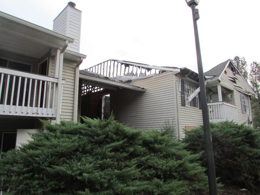 apartment fire damage exterior roof siding balcony remediation