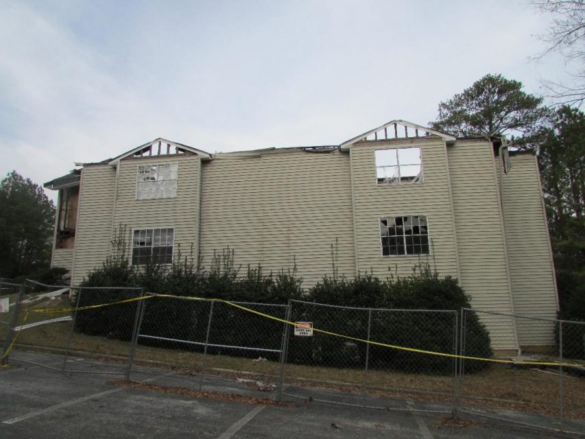 apartment fire damage exterior siding roof remediation