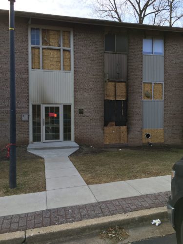 apartment fire damage exterior siding window remediation