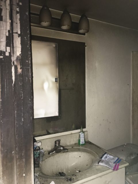 apartment fire damage interior bathroom remediation