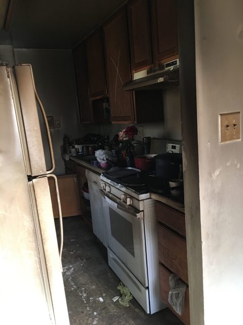 apartment fire damage interior kitchen remediation