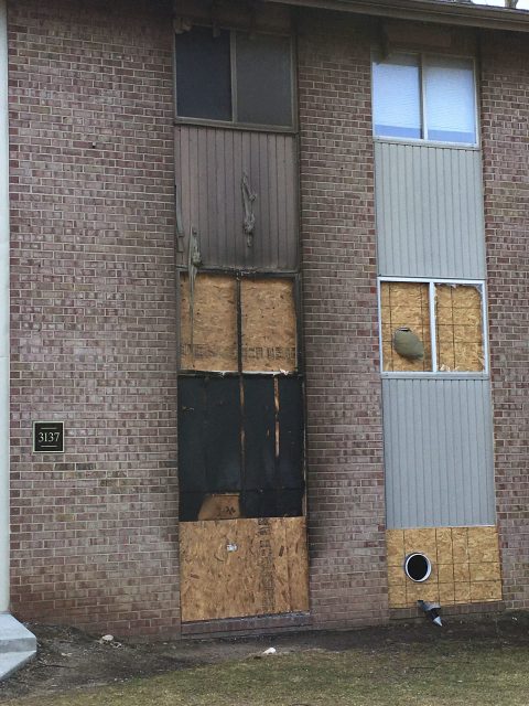 apartment fire exterior siding window remediation