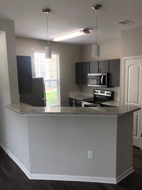 providence header and slider 2 - apartment kitchen countertop cabinet light appliances renovation